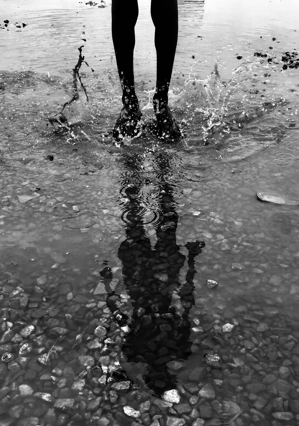 time-lapse photography of person stomping feet on water