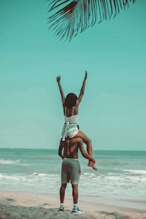 couple sits on the seashore