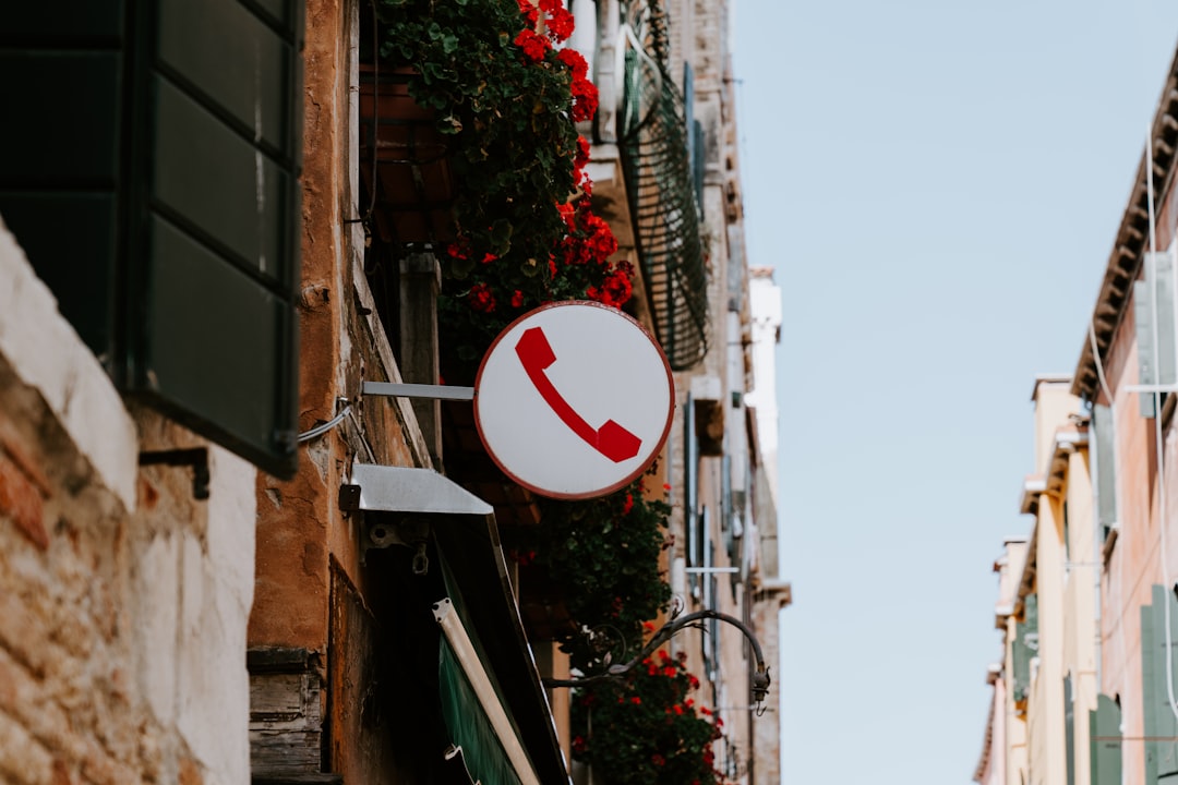 white and red telephone signage