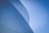 low-angle photography of blue glass walled building during daytime