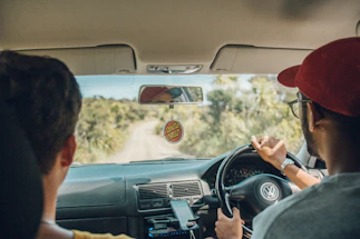 two men inside car