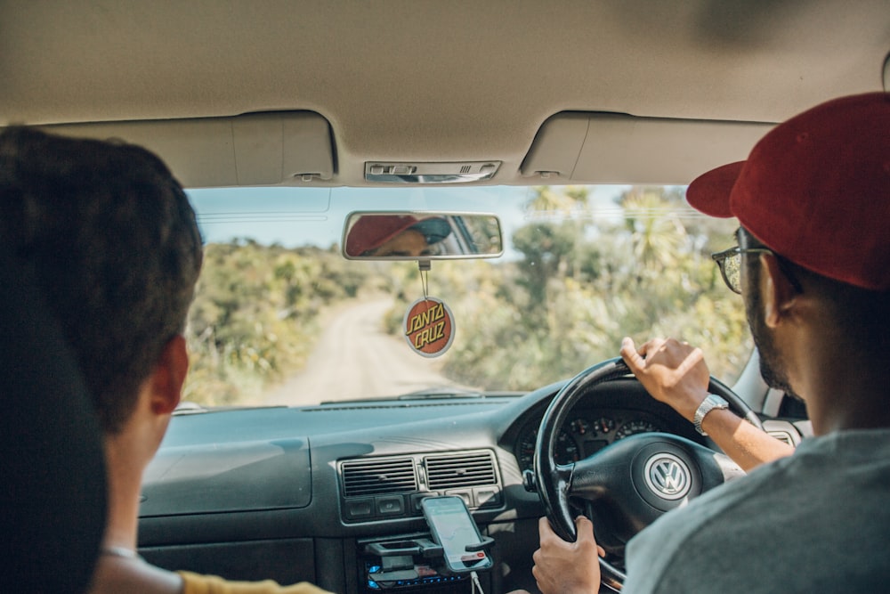 two men inside car