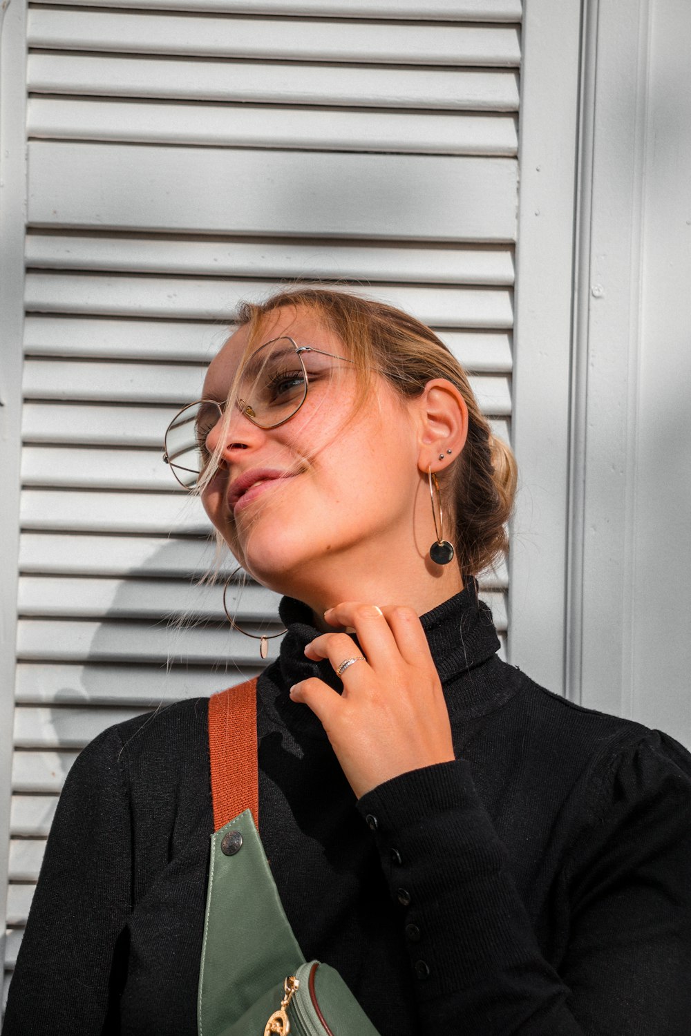 woman wearing black turtle-neck long-sleeved shirt