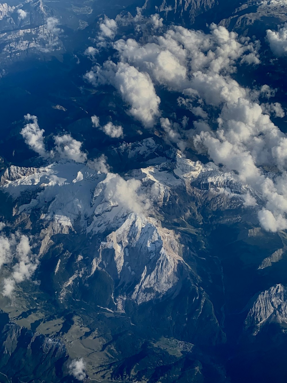 aerial photography of mountain range and clouds during daytime