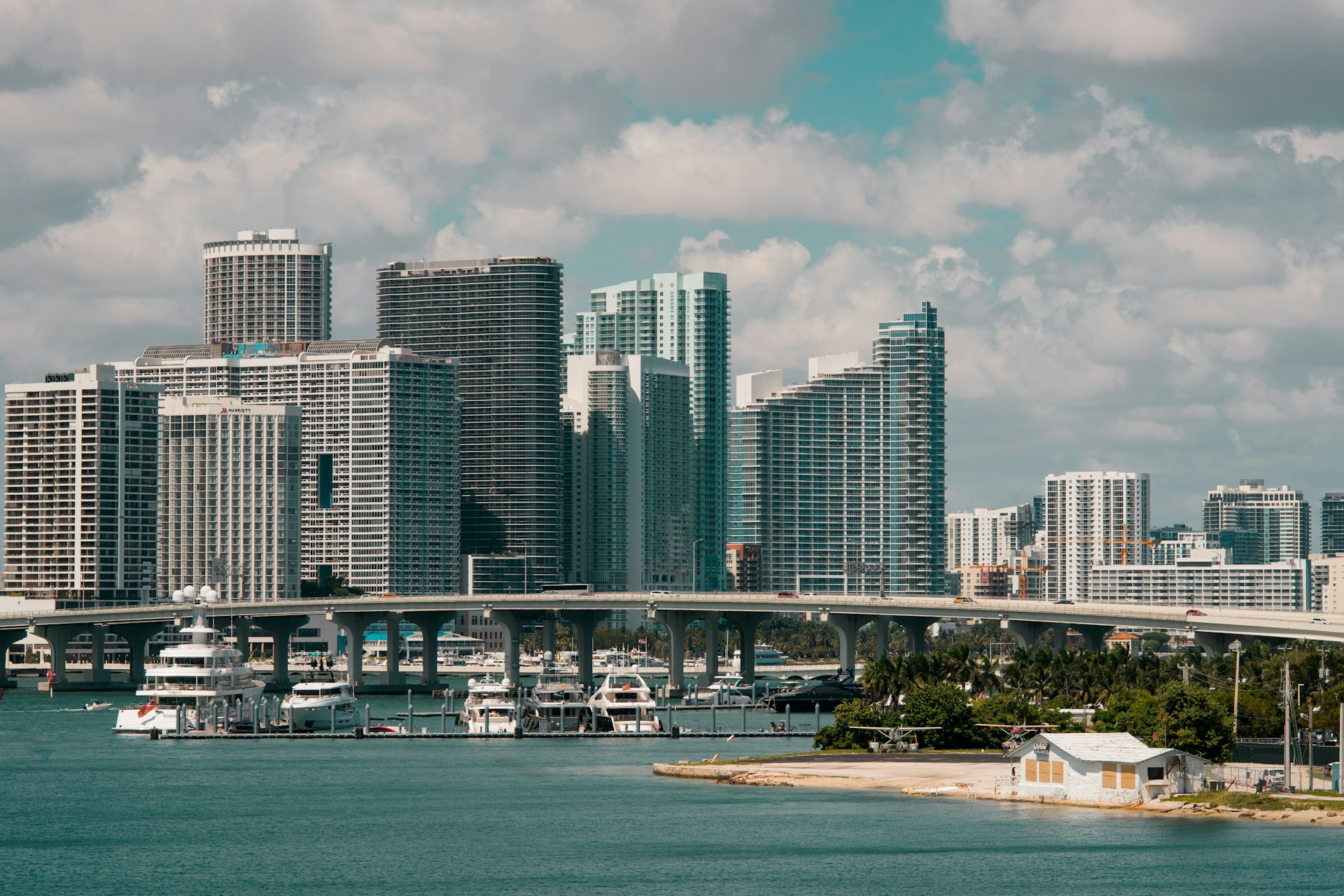 gray and white concrete high-rise buildings under white sky