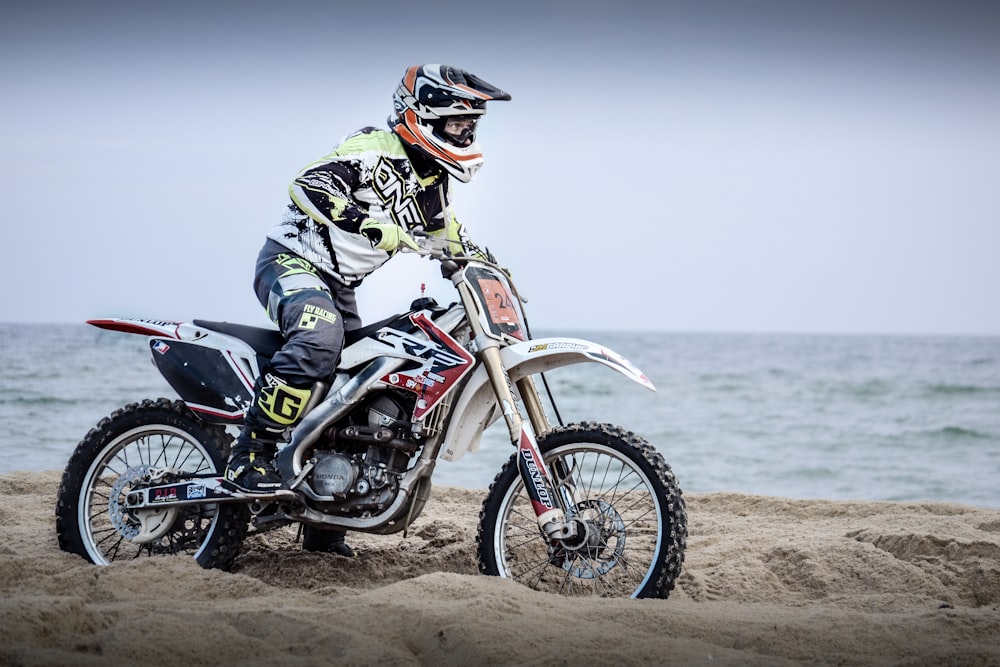 man riding on dirt bike during daytime