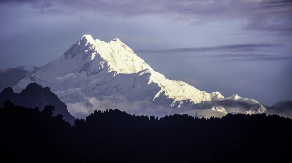 white and black mountain under blue sky at daytime