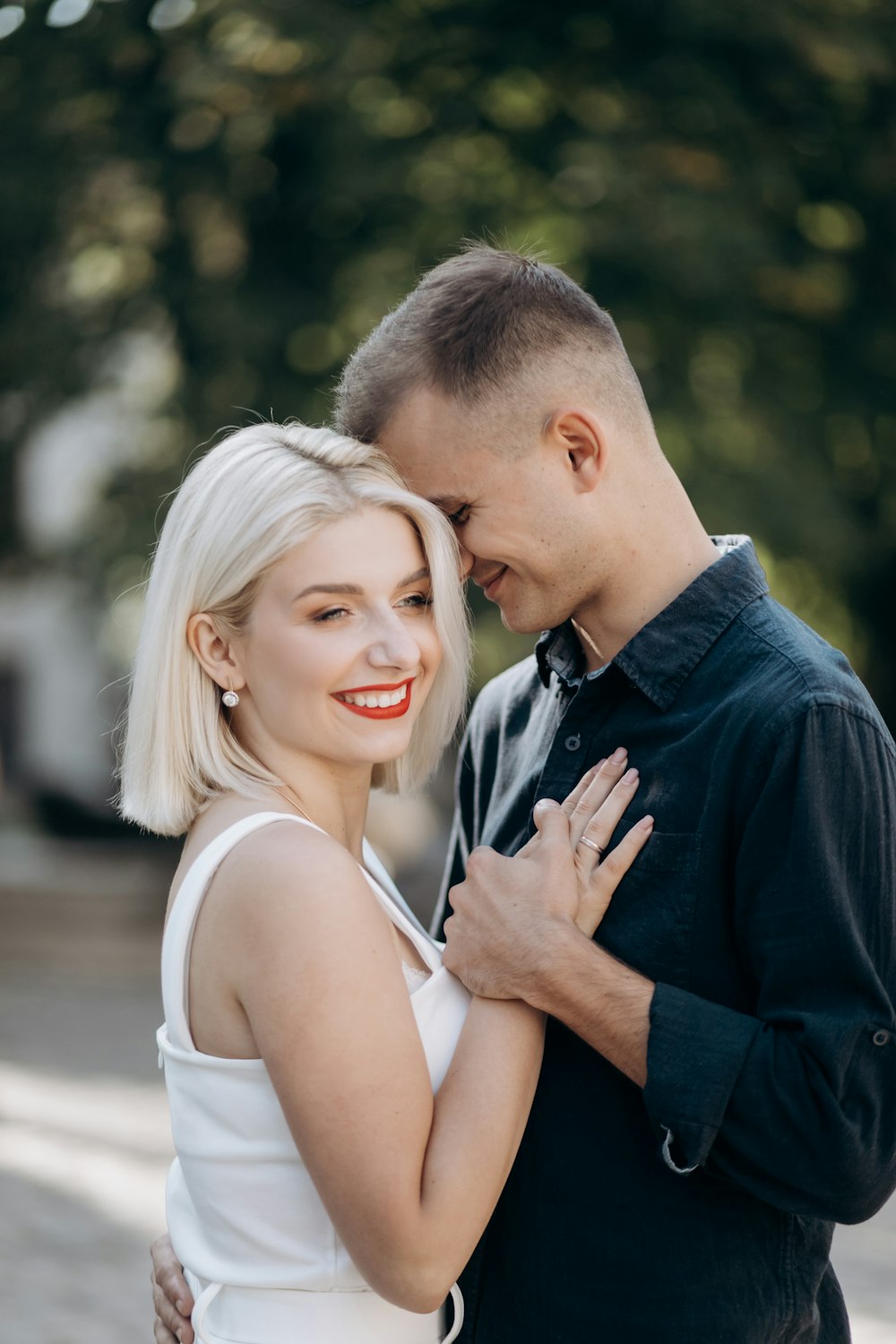 smiling man and woman outdoors