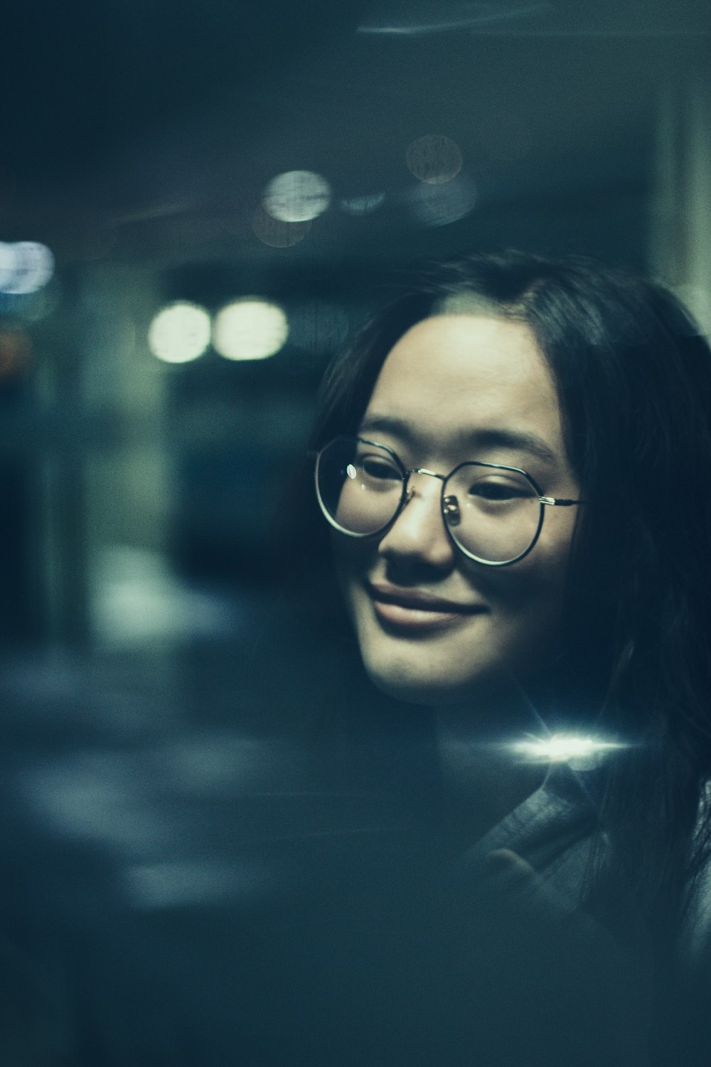 woman wearing grey framed eyeglasses