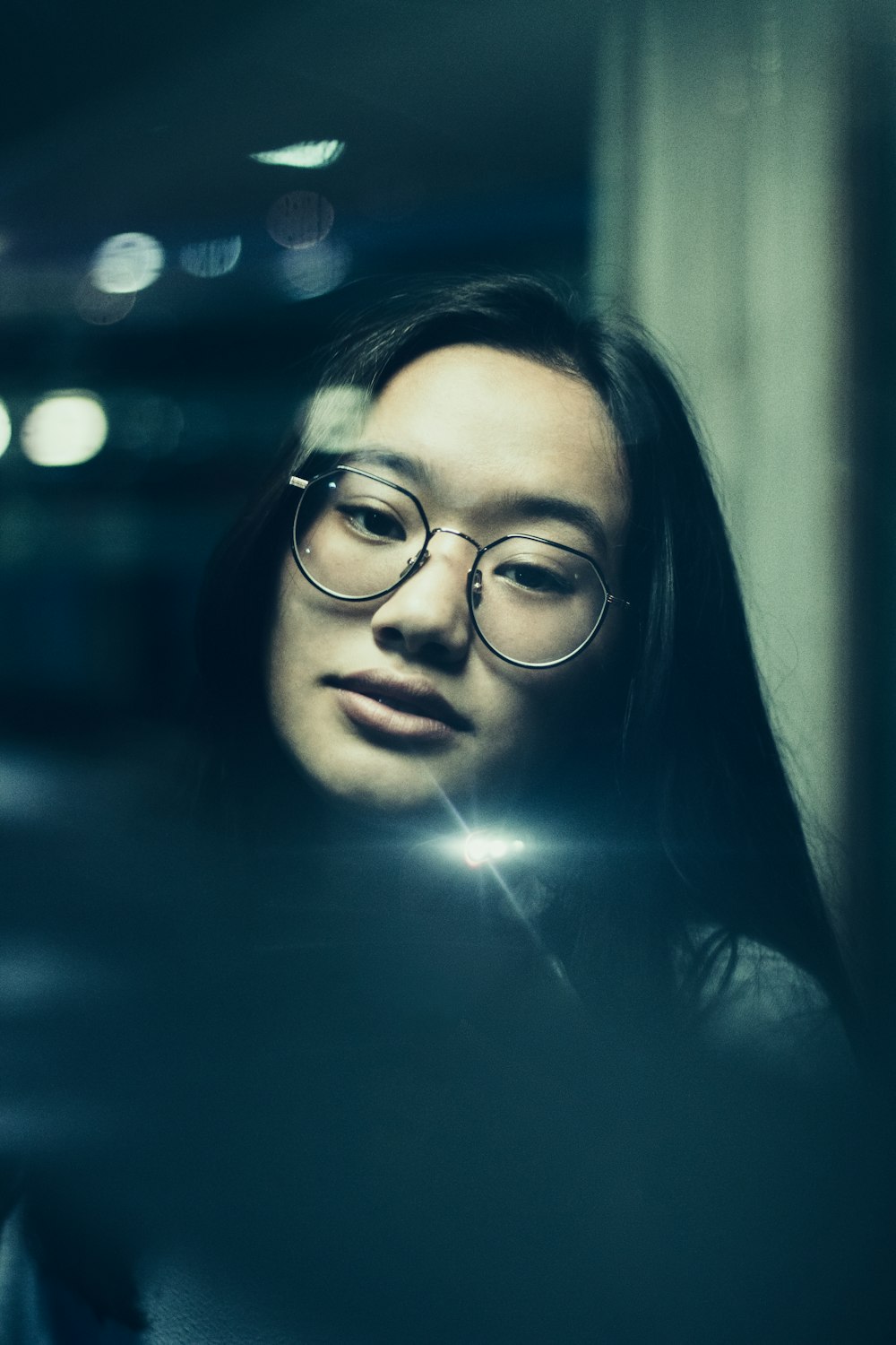 portrait photo of woman wearing aviator sunglasses