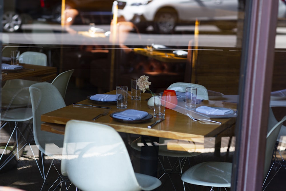 square brown table with white chairs set