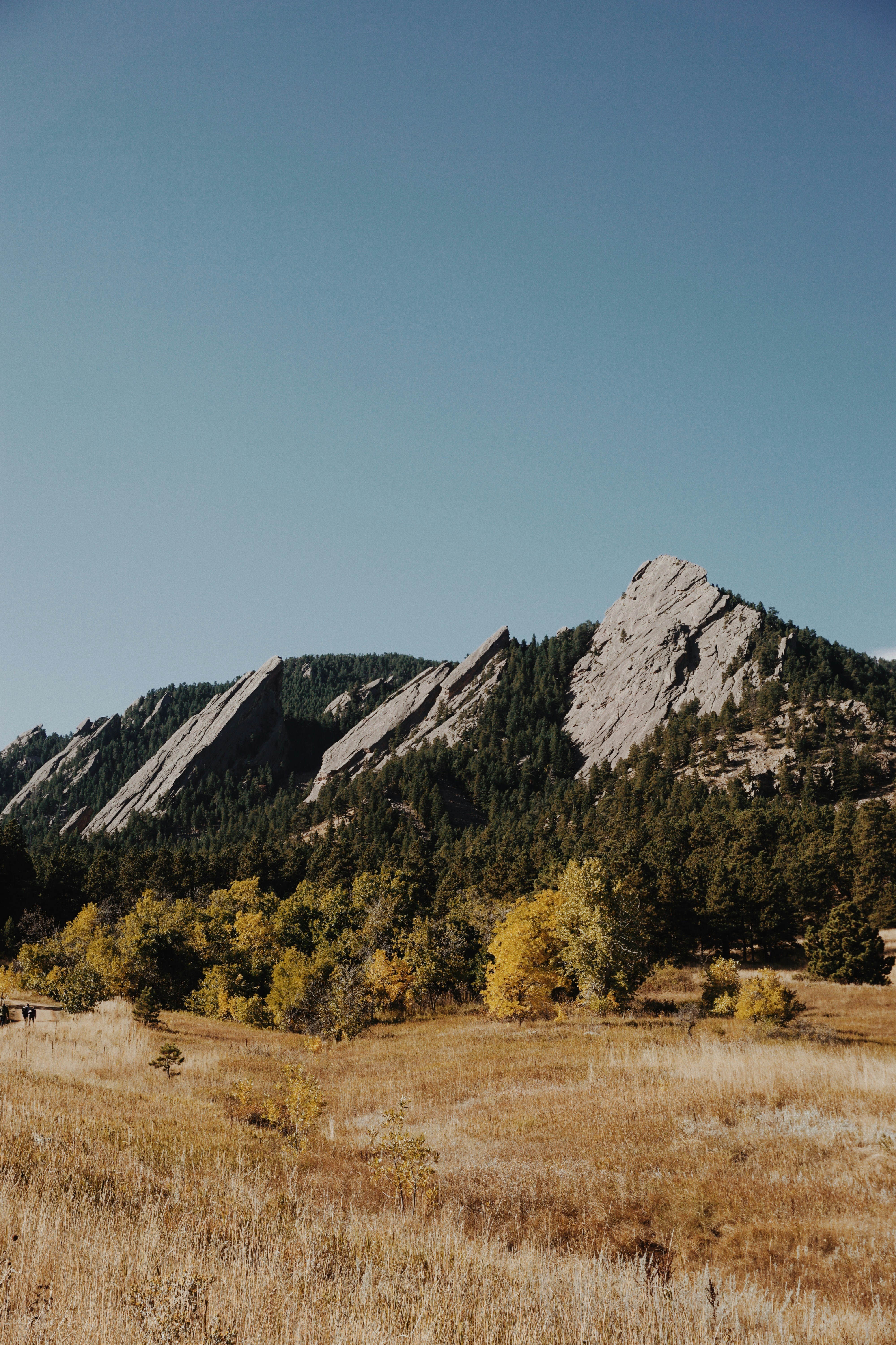 brown and green mountains under blue sky