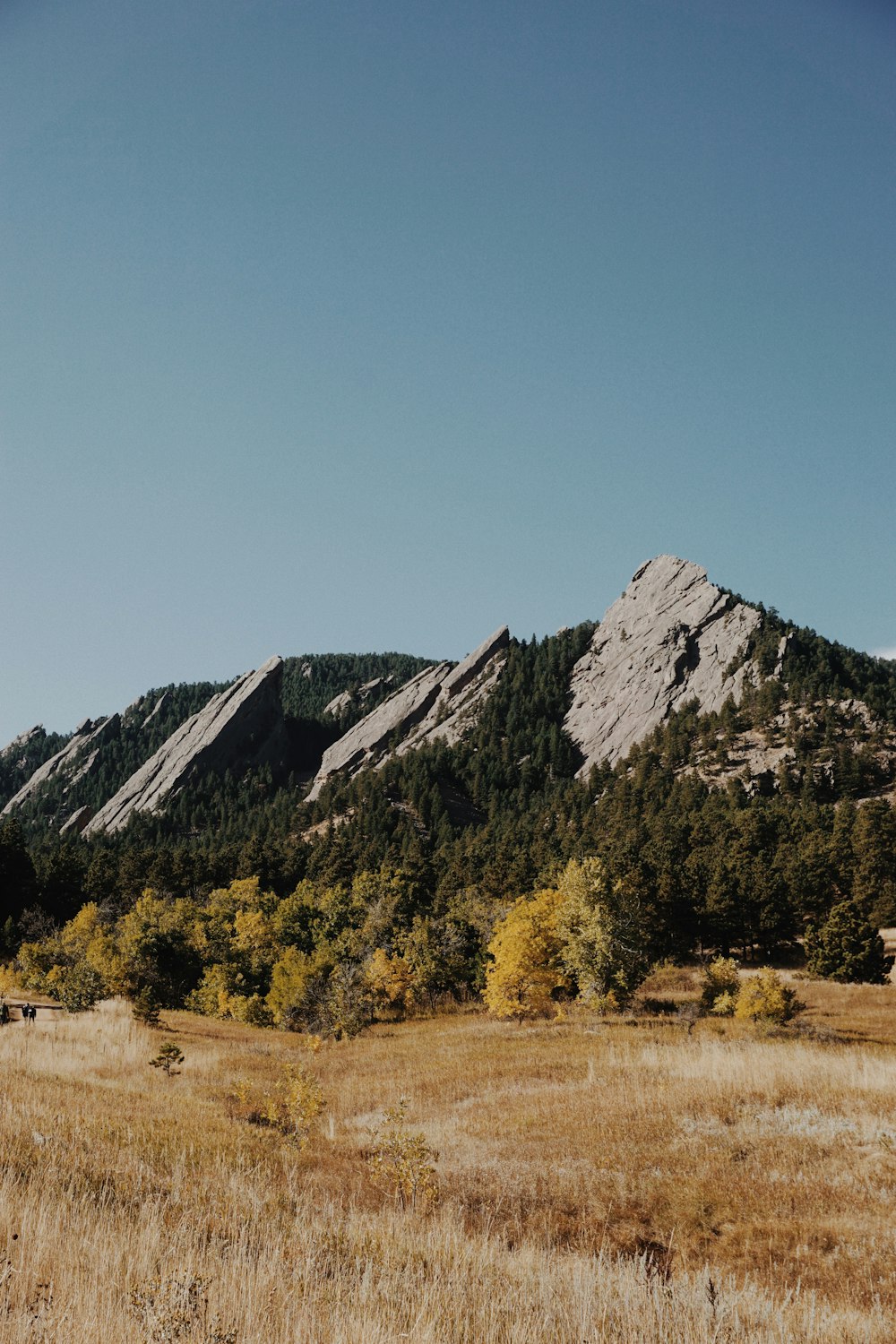 brown and green mountains under blue sky