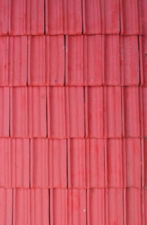 Rows of ceramic tiles lined up in the factory showcasing uniform size and color