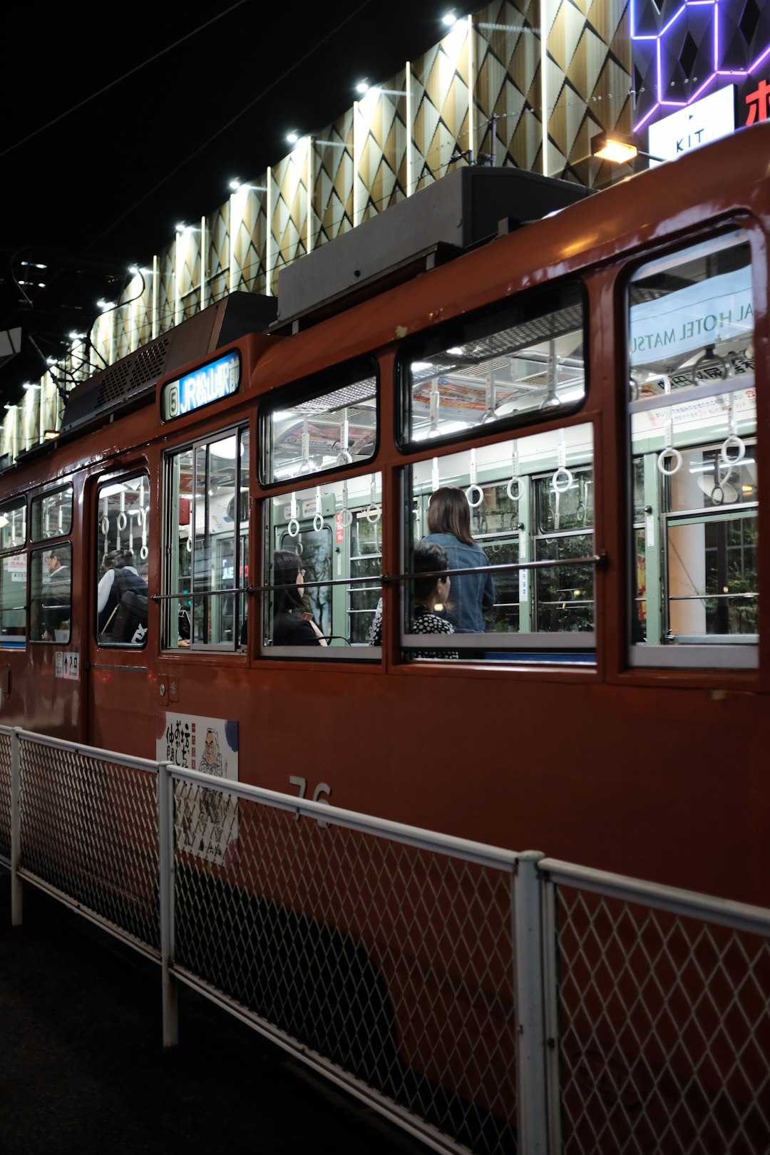 brown train near white railings