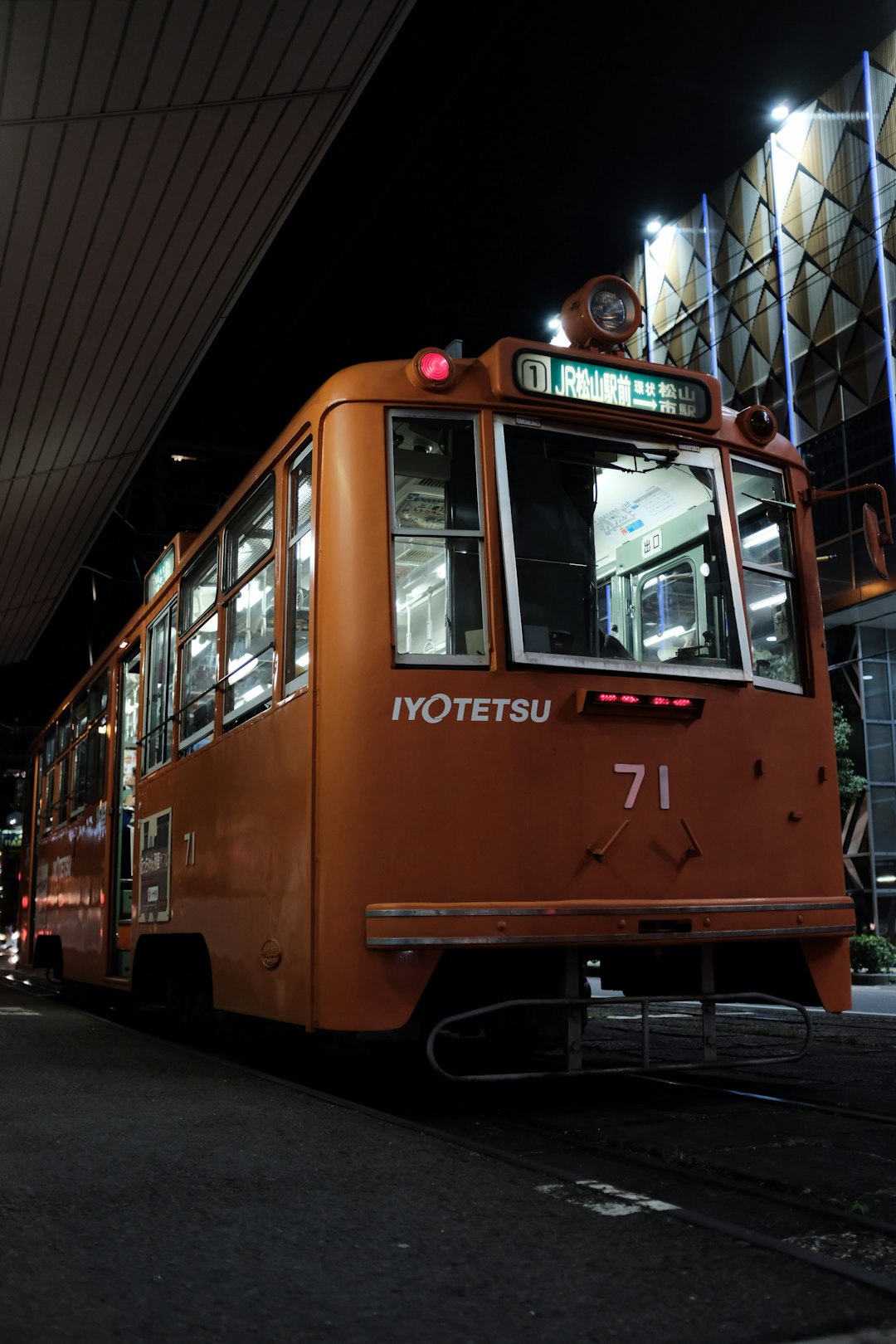 shallow focus photo of orange bus