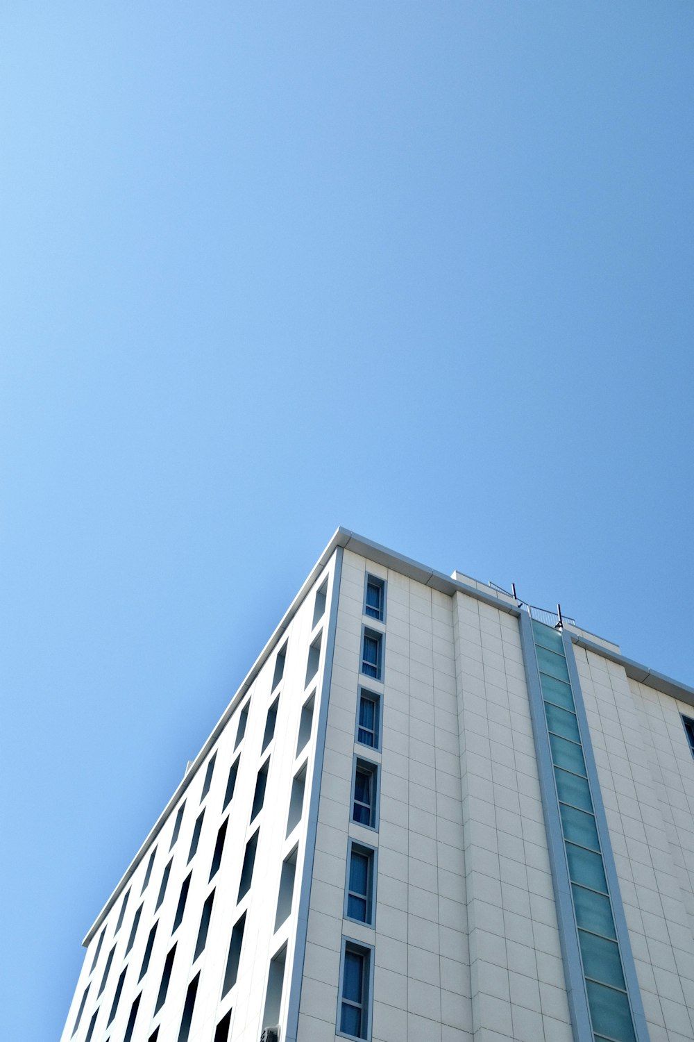 low-angle photograph of white concrete building