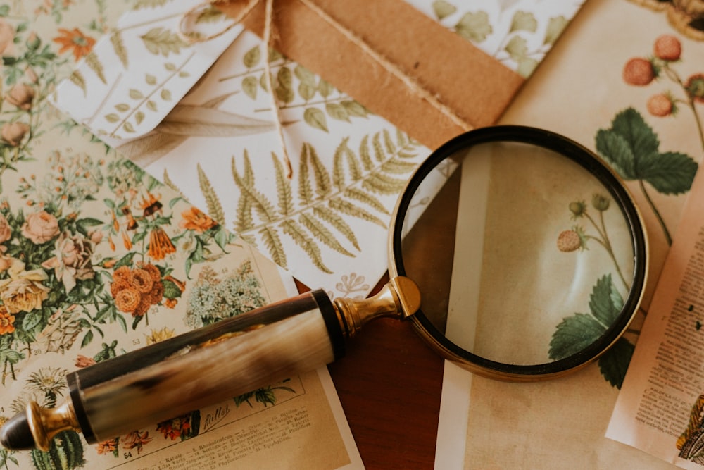 magnifying glass on wooden surface