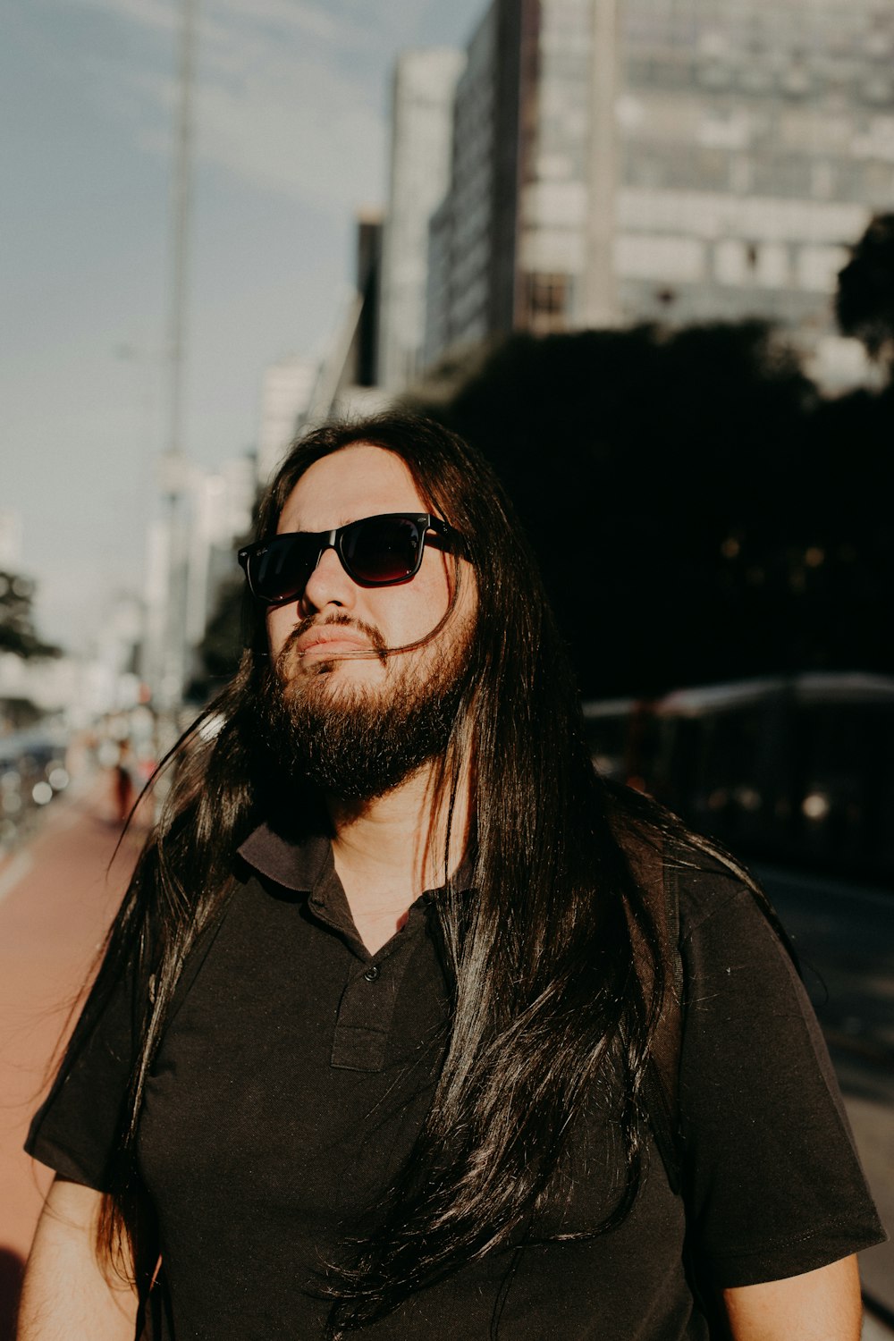 man wearing black polo shirt