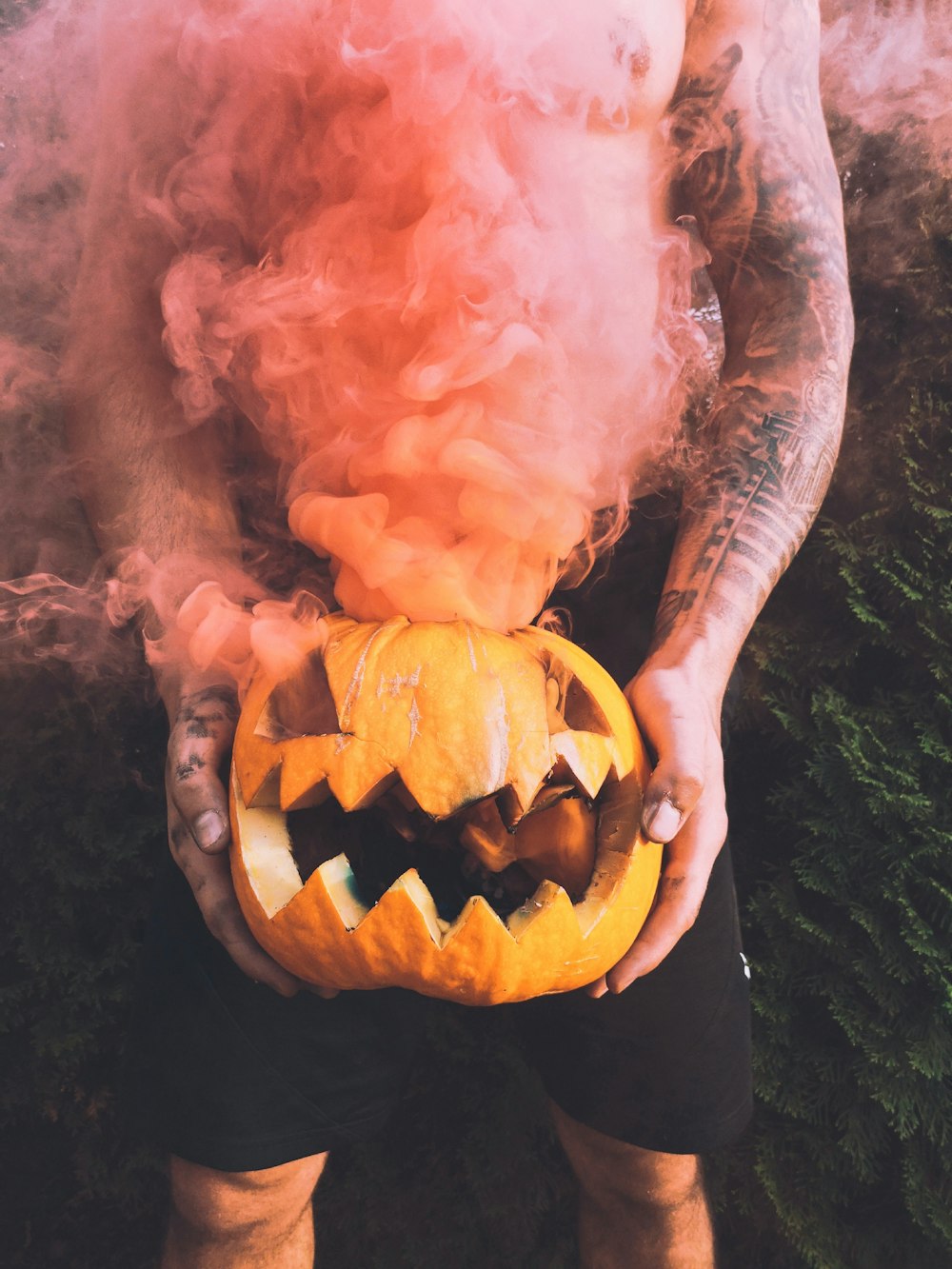 person holding Halloween pumpkin