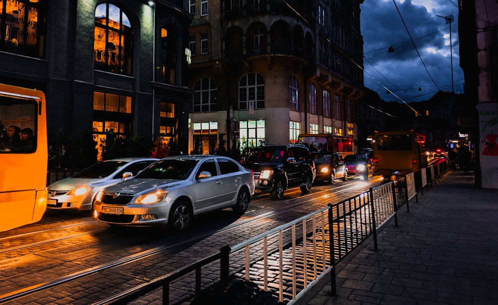gray sedan on street during nighttime