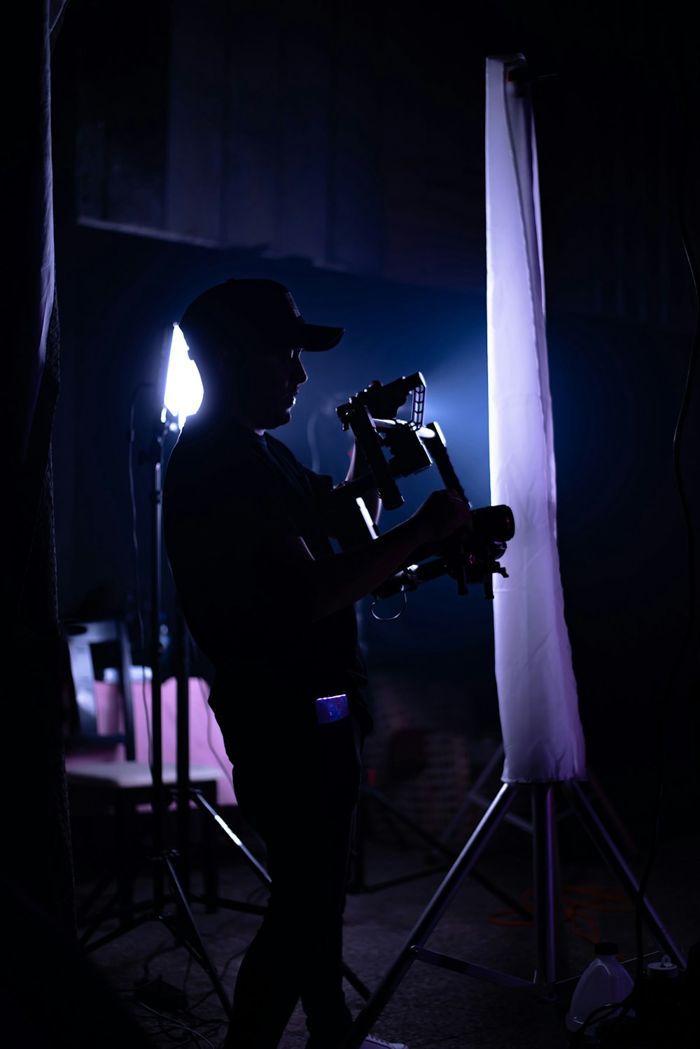 silhouette of man carrying camera