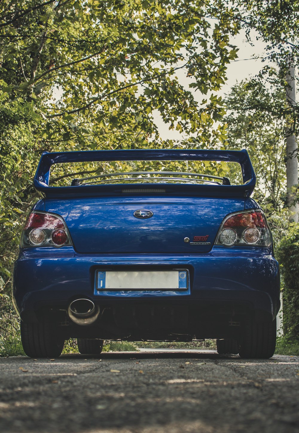 parked blue Subaru car