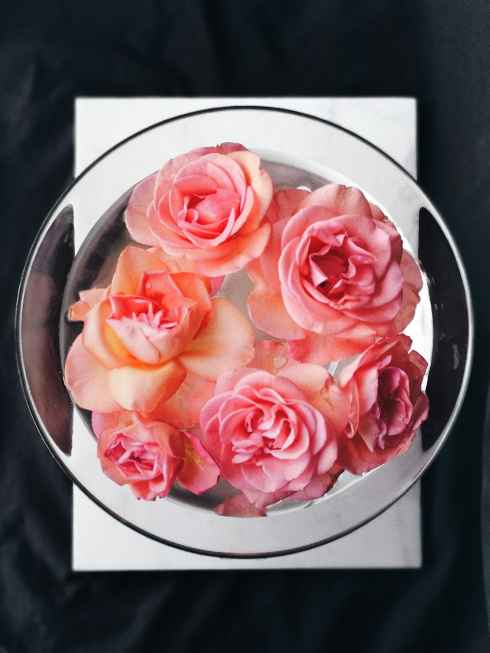 pink rose flowers in round clear glass bowl