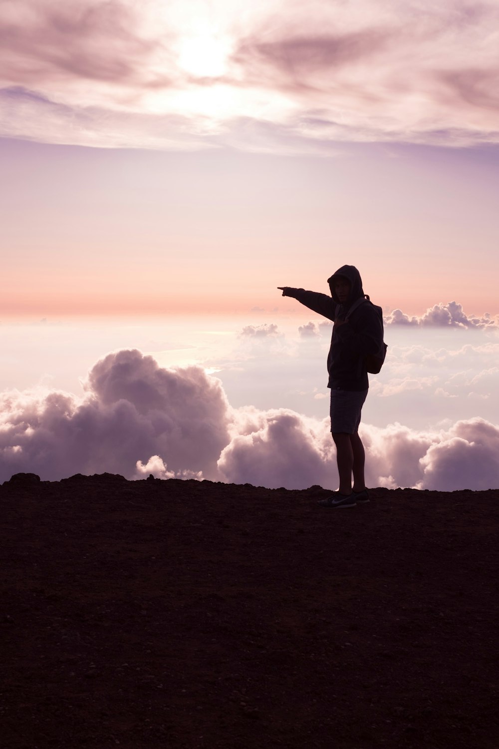 person standing on hill