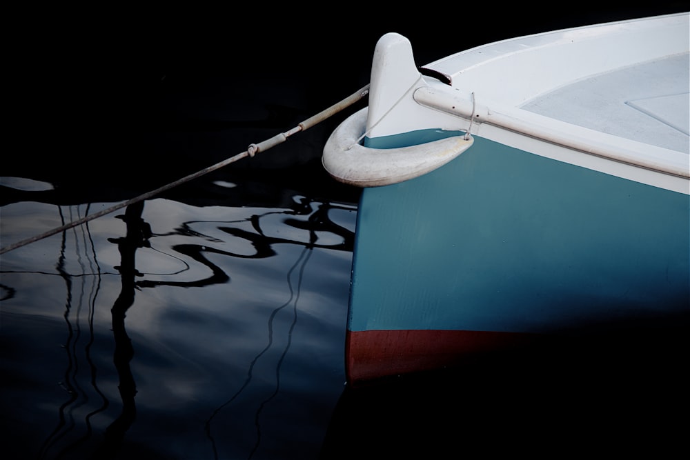 white and blue boat during daytime