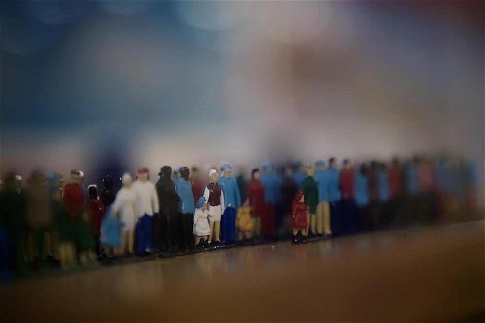 line of standing people painting