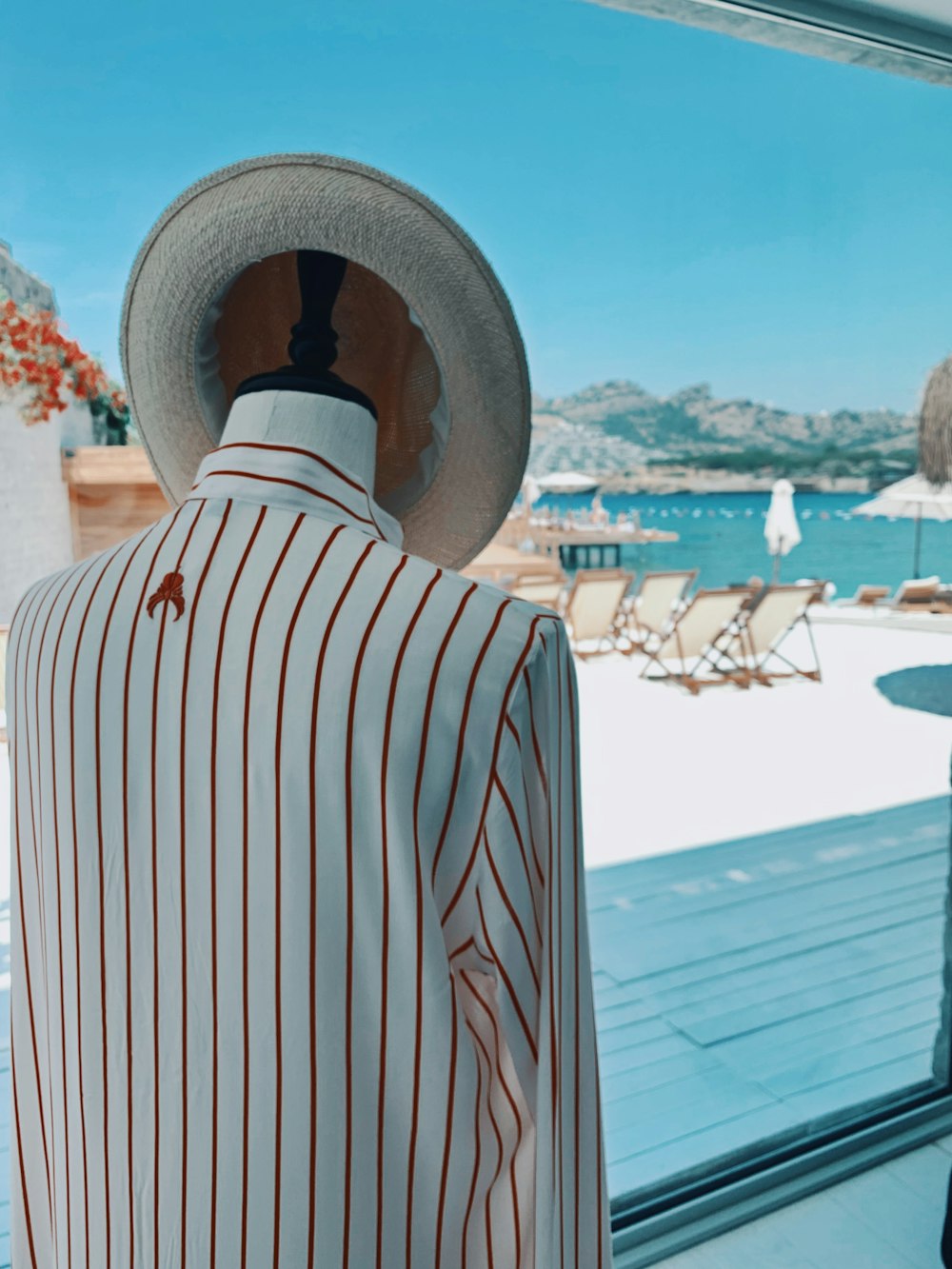white and red striped top and hat on rack