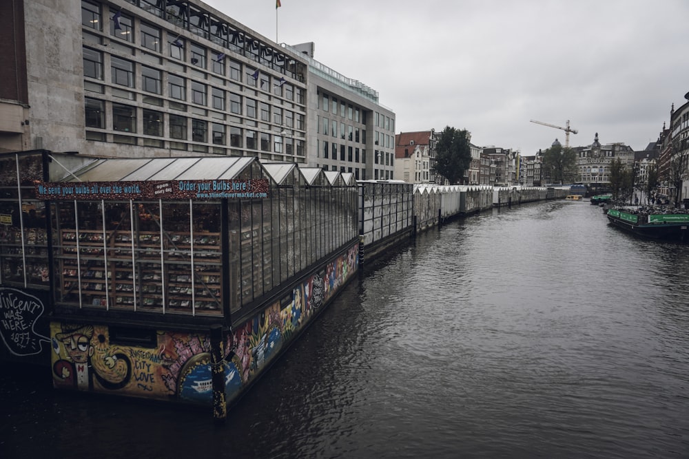 buildings beside canal during day