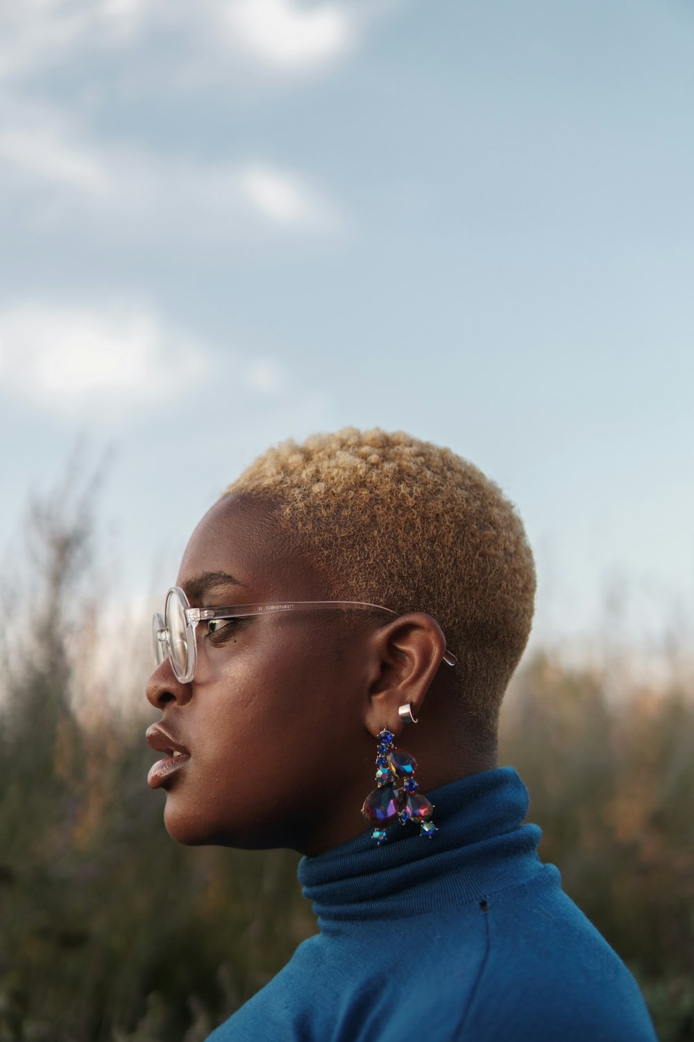 woman wearing blue turtleneck shirt