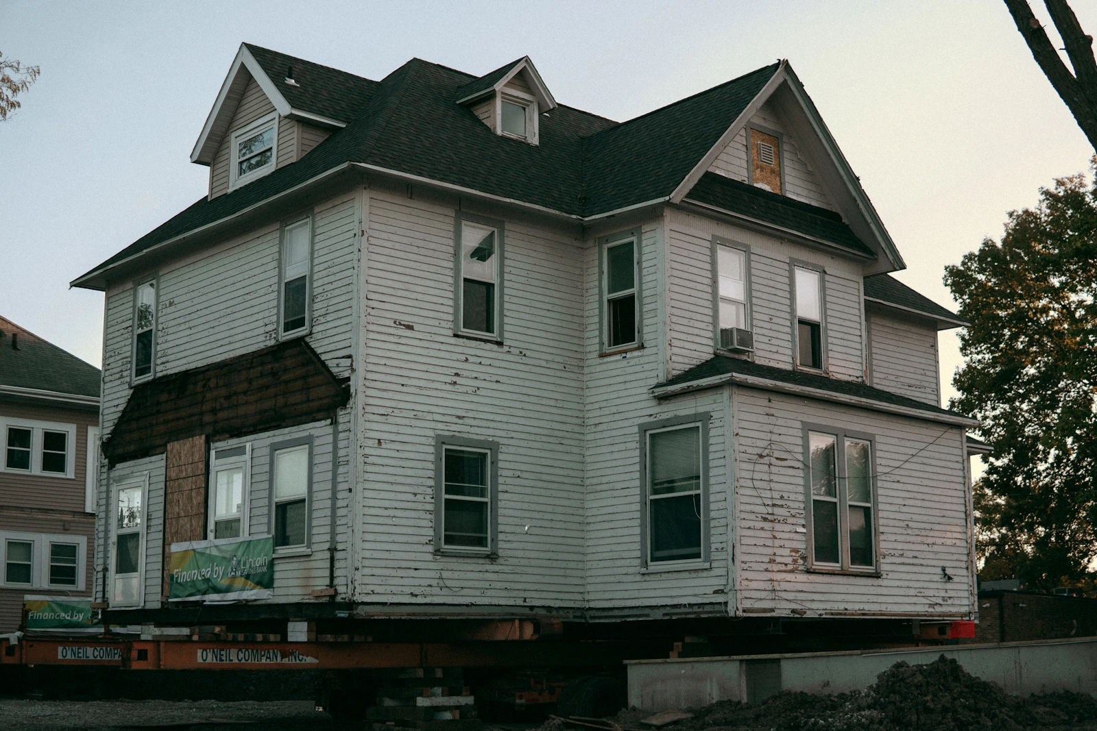 A building under renovation with old and new structure visible side by side