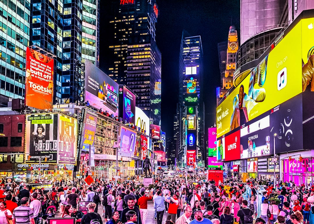 people in street at nighttime, NYC 2019
