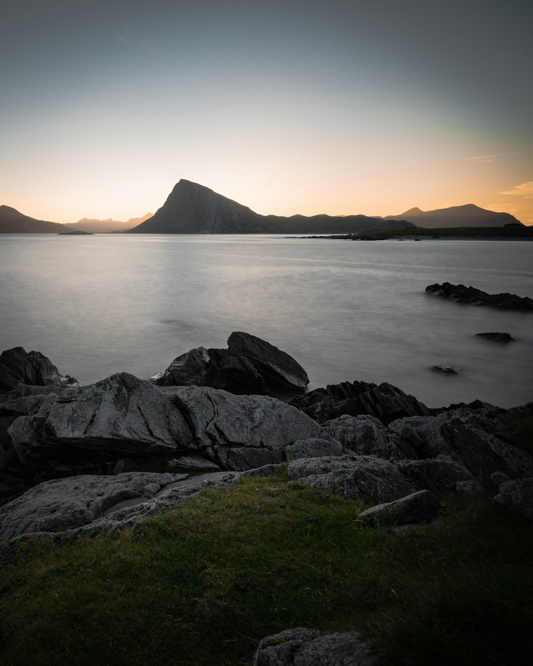 rocky island beside sea