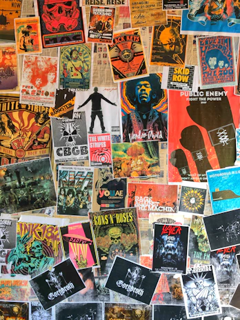A colorful collage of concert posters showcasing bold graphics and dynamic typography by bombpop13.