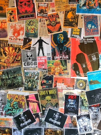 A collection of classic progressive rock band posters pinned on a wall.
