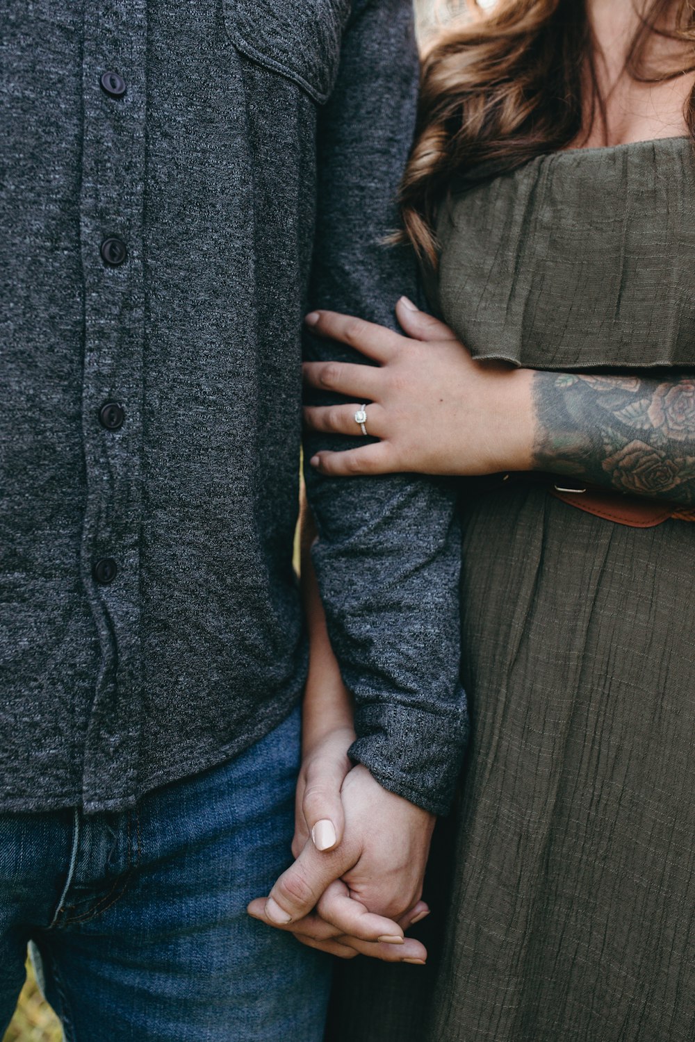 standing woman and man holding hands