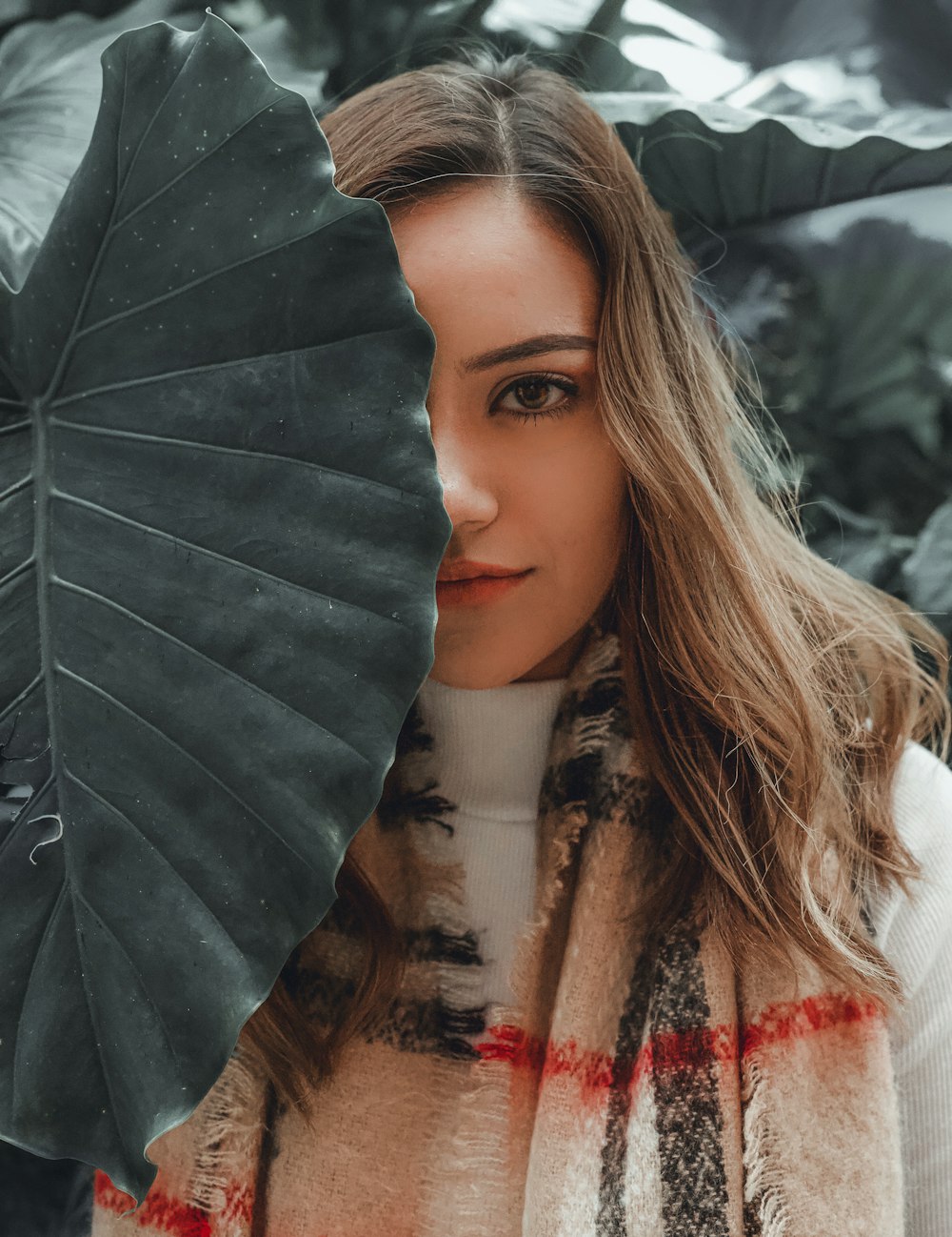 woman behind leaf