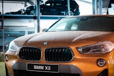 orange BMW vehicle during daytime