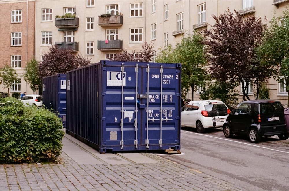 blue intermodal container on pavement