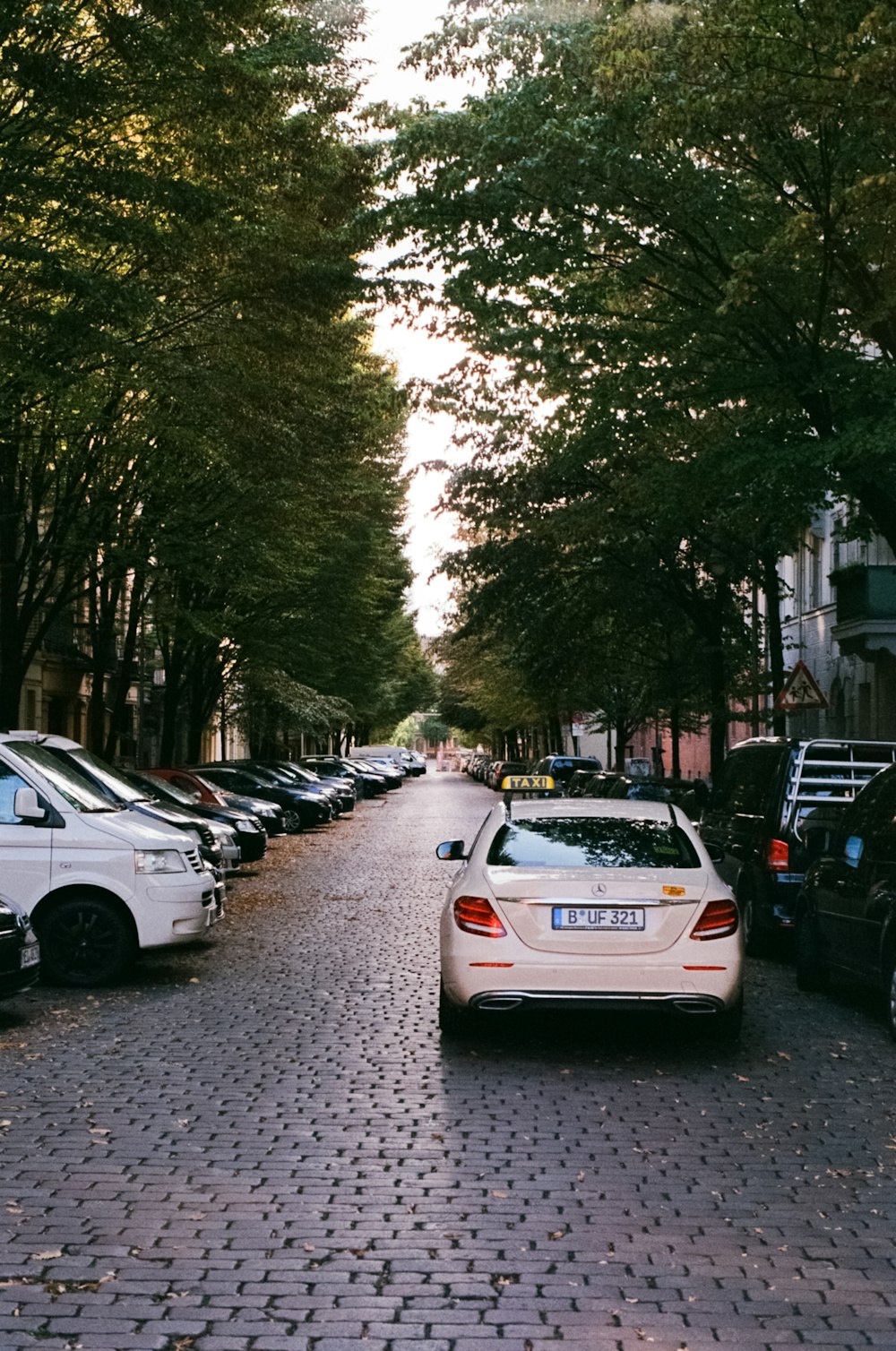 white car on road