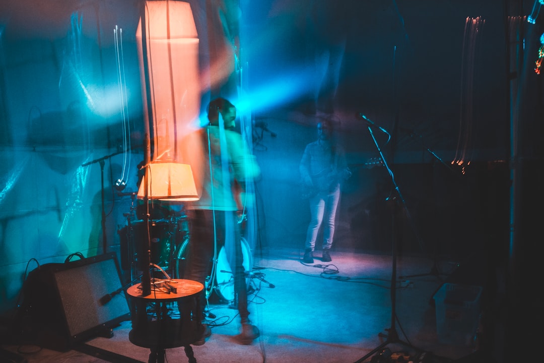 two men standing on stage