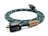 A coiled green woven power cable with white accents features a wooden label that reads 'Arapuni PH-1, Designed in New Zealand.' The plug is black with visible metal prongs and labeled 'Furutech.'