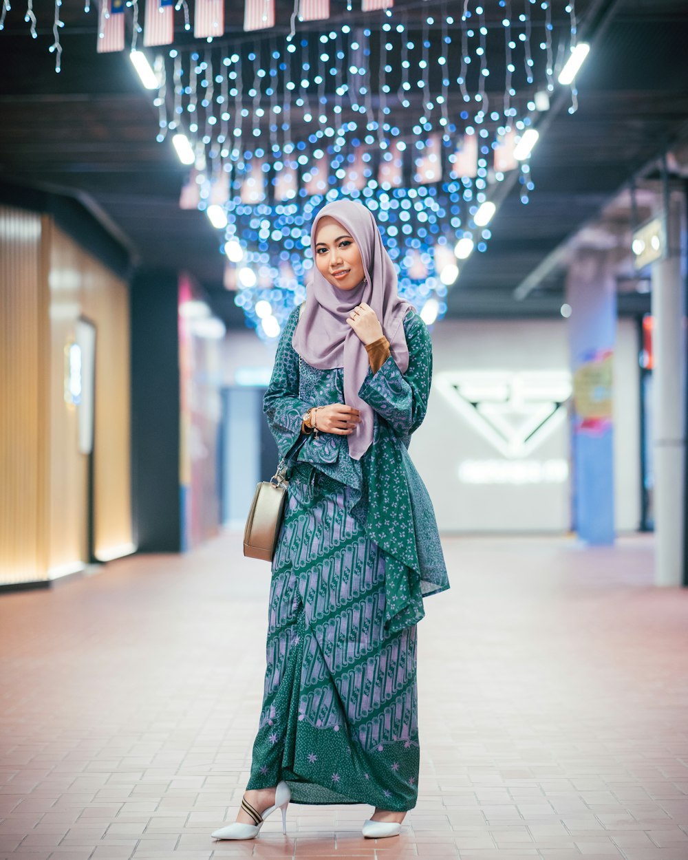 shallow focus photo of woman wearing green long-sleeved dress