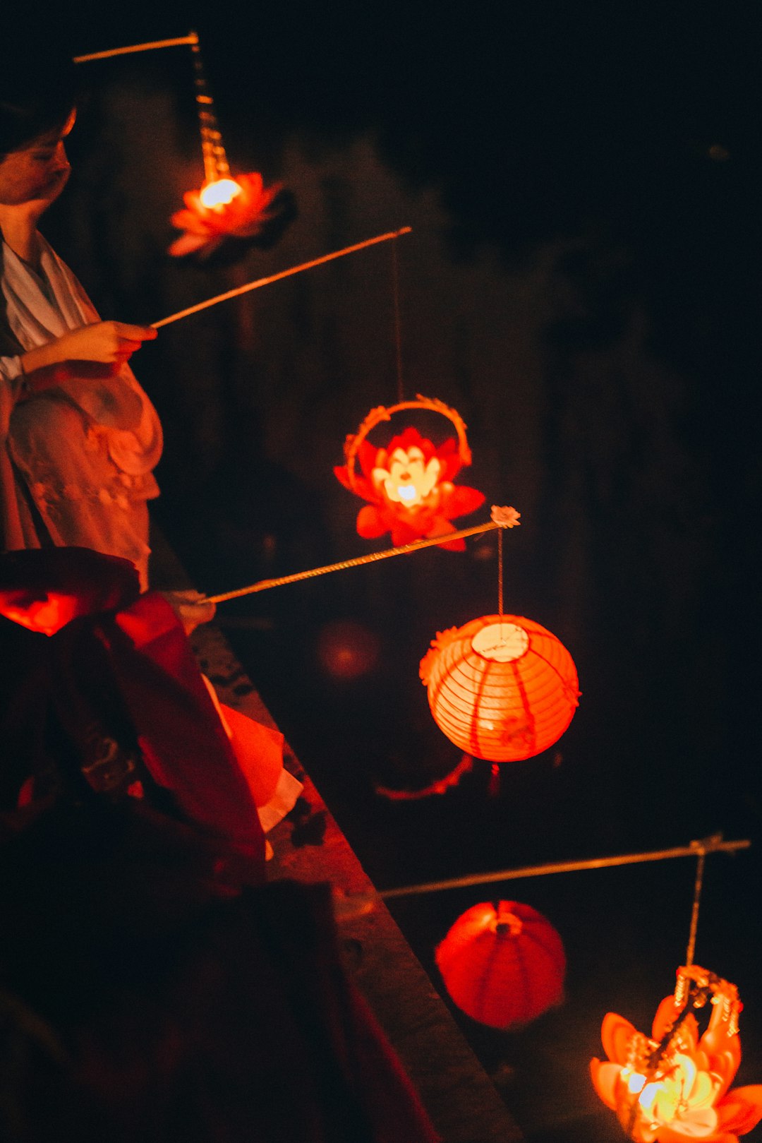 person holding Japanese lantern