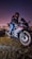 A powerful motorcycle revving on a city street, embodying freedom and adventure.