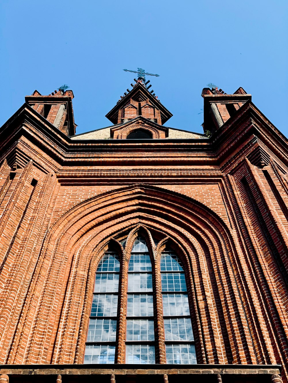 low-angle photograph of brown brick structure